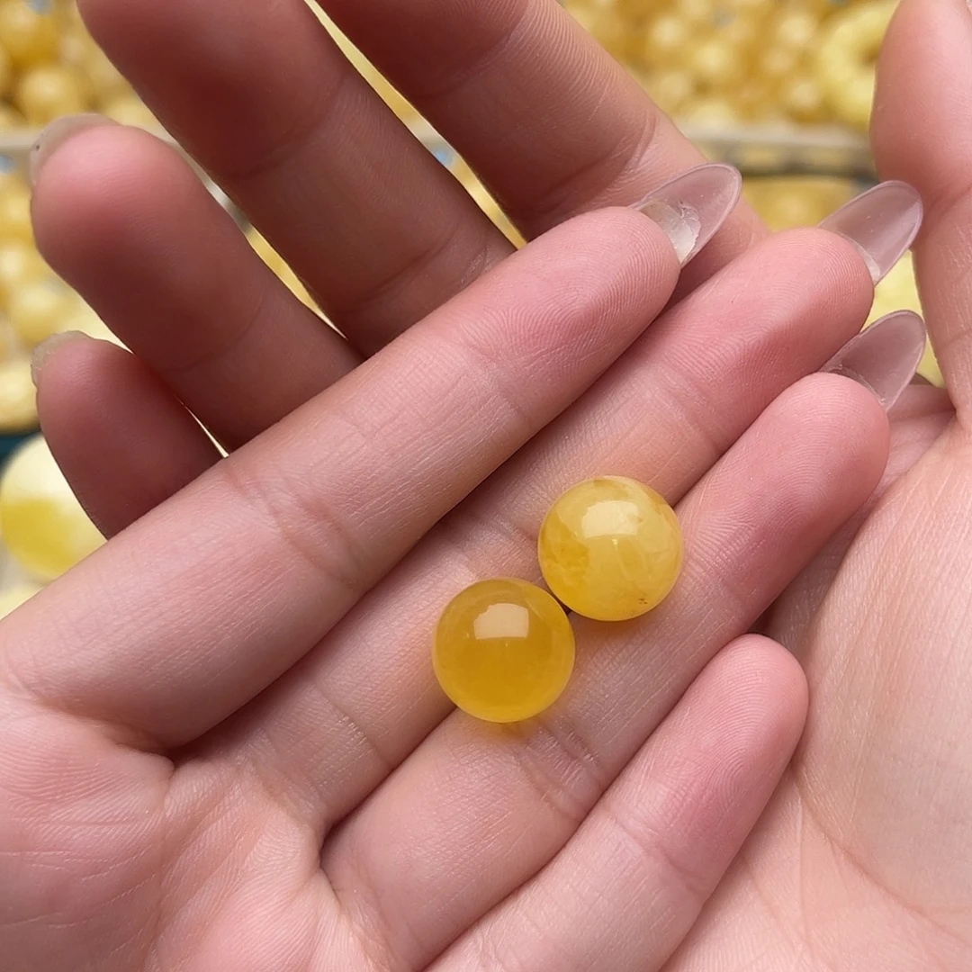 琥珀未镶嵌裸石蜜蜡圆珠一对微瑕
