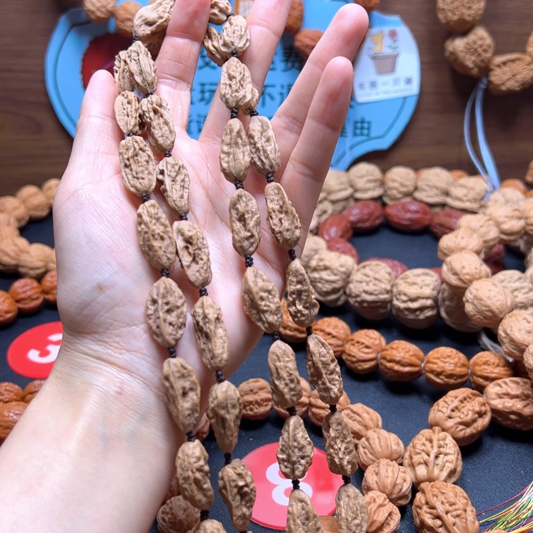 石***鱼文玩核桃吊坠葡萄干异形12加