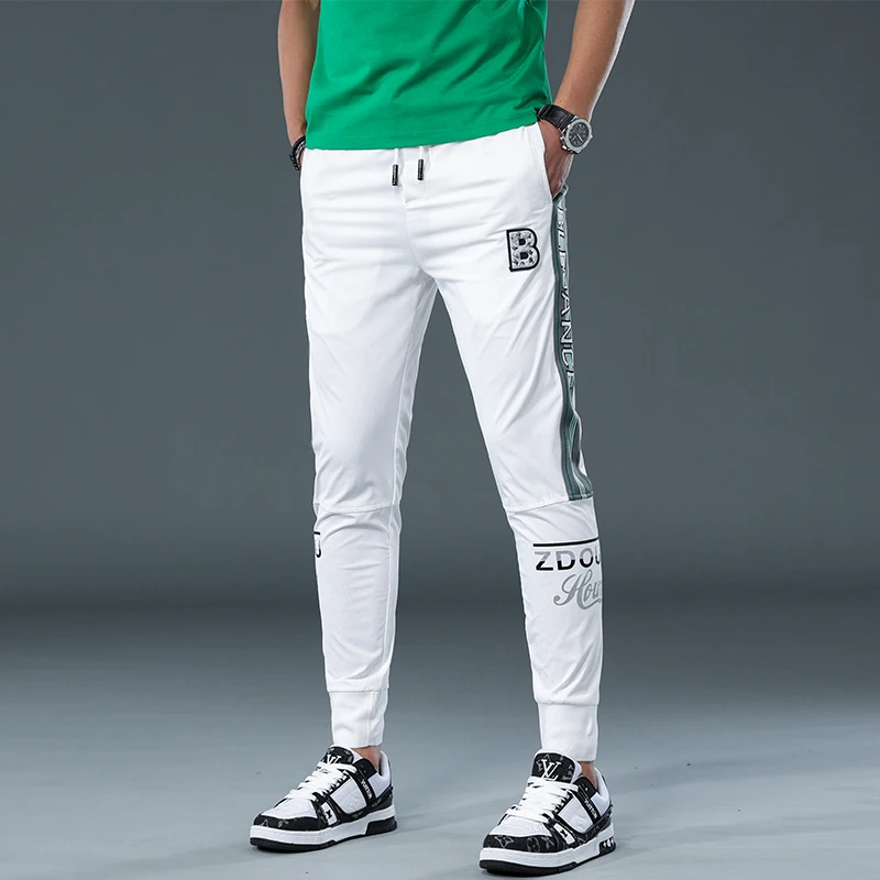 2025夏季新款冰丝休闲裤男潮流白色薄款束脚运动裤子韩版修身卫裤