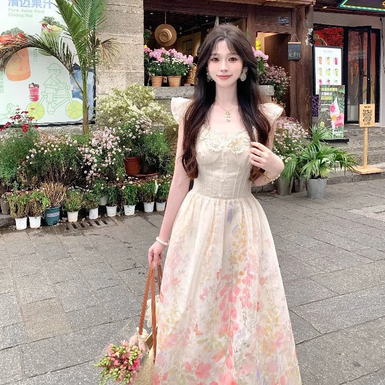 夏季新款法式气质小众设计温柔风度假游玩拍照小飞袖印花连衣裙女