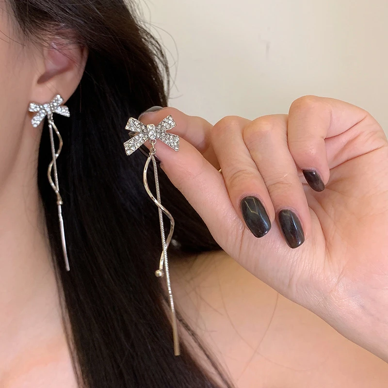 925银合成锆石耳饰 S925银针韩版新款简约银色蝴蝶结长款耳环淑女