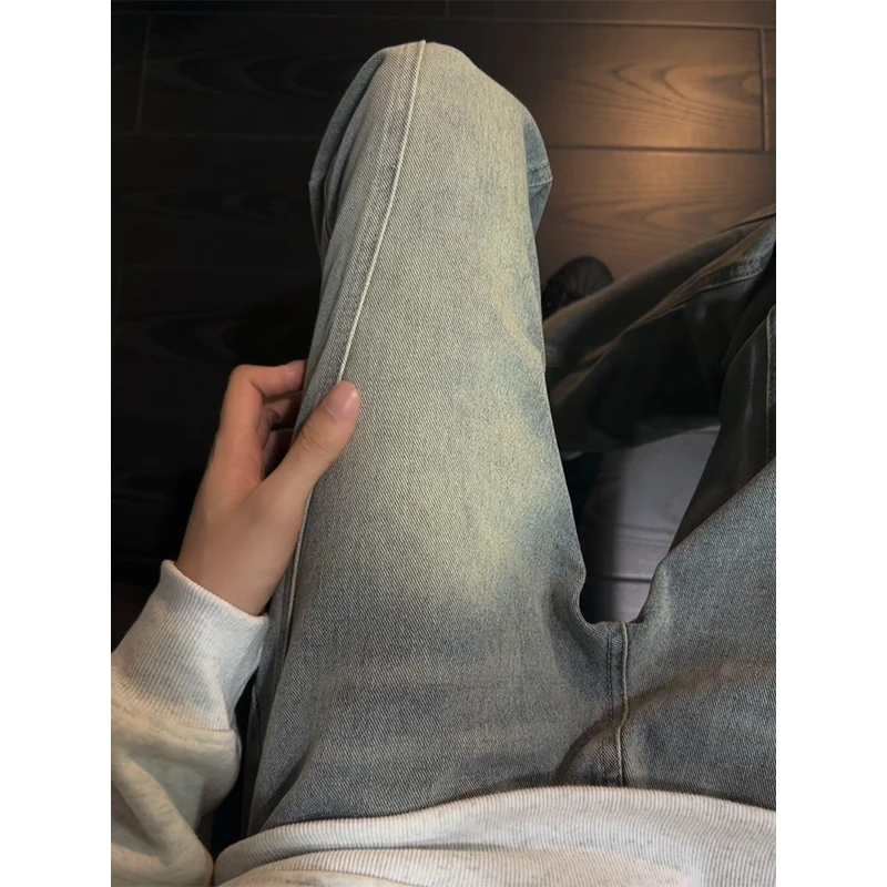 美式复古斜切牛仔裤男款秋冬季小众设计感裤子高街弯刀微喇工装裤