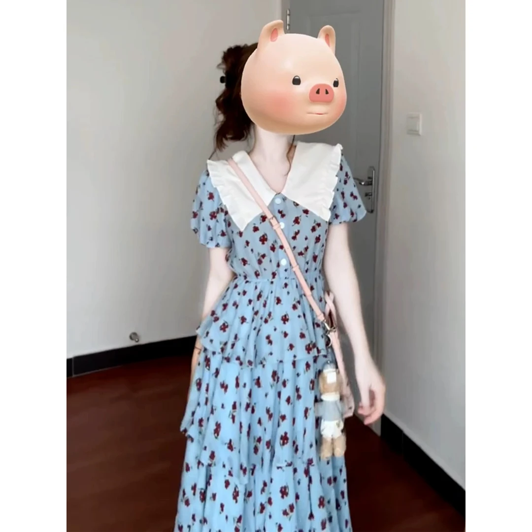 蓝色娃娃领碎花连衣裙子女夏季2025新款法式气质海边度假收腰长裙