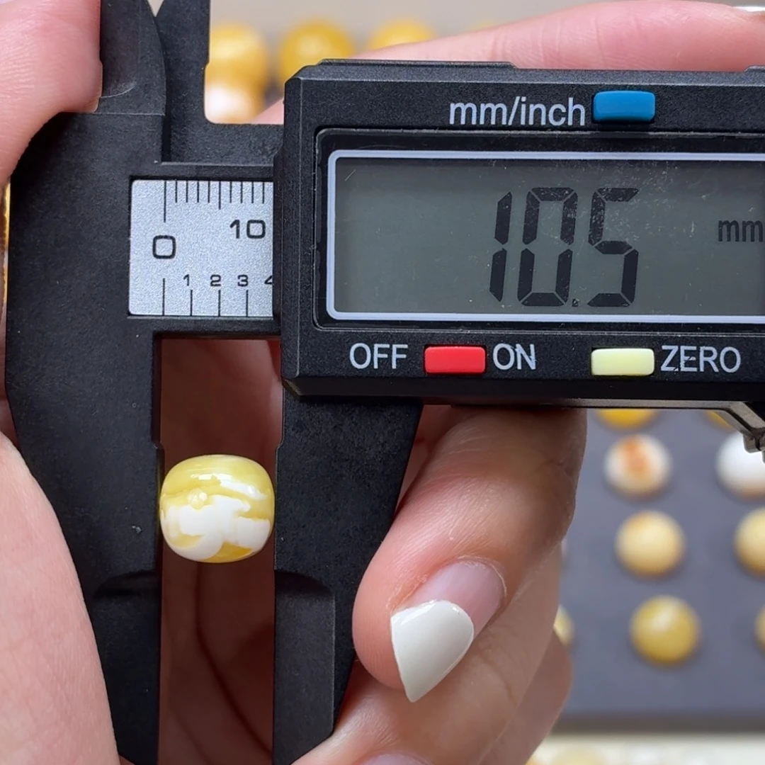 琥珀未镶嵌裸石俄料金瓷白溶洞10.5mm