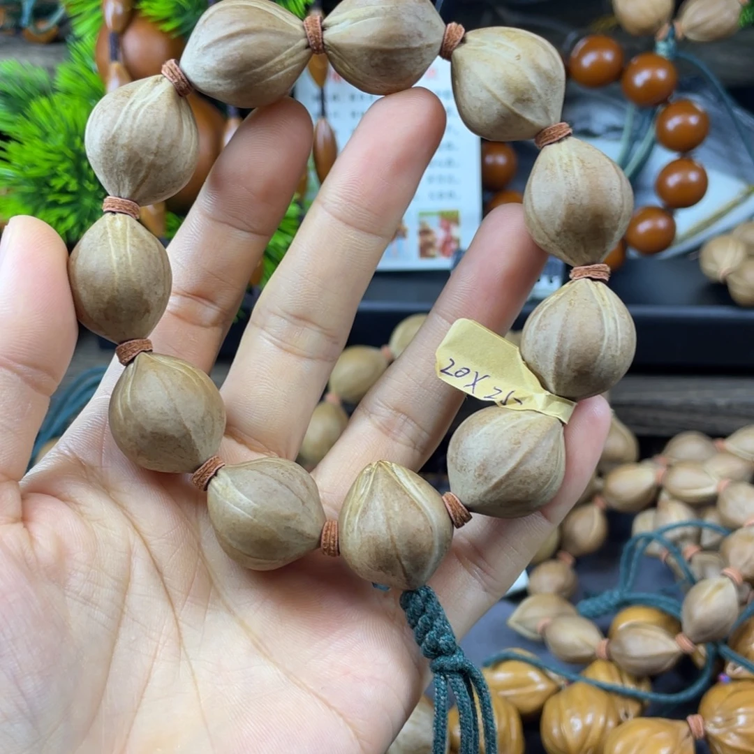 ๑***๑吊坠橄榄核001四花铁核老料