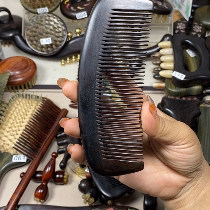 焦***朵紫光檀加大半月顺发梳