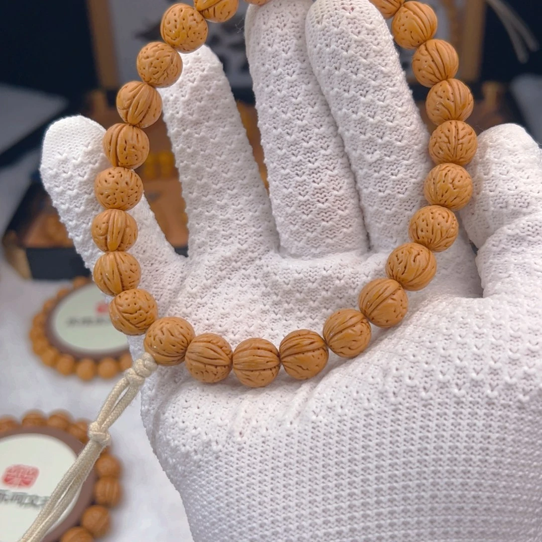 墨***轩桃核手串1.2「黄金瞳」野生桃核手持