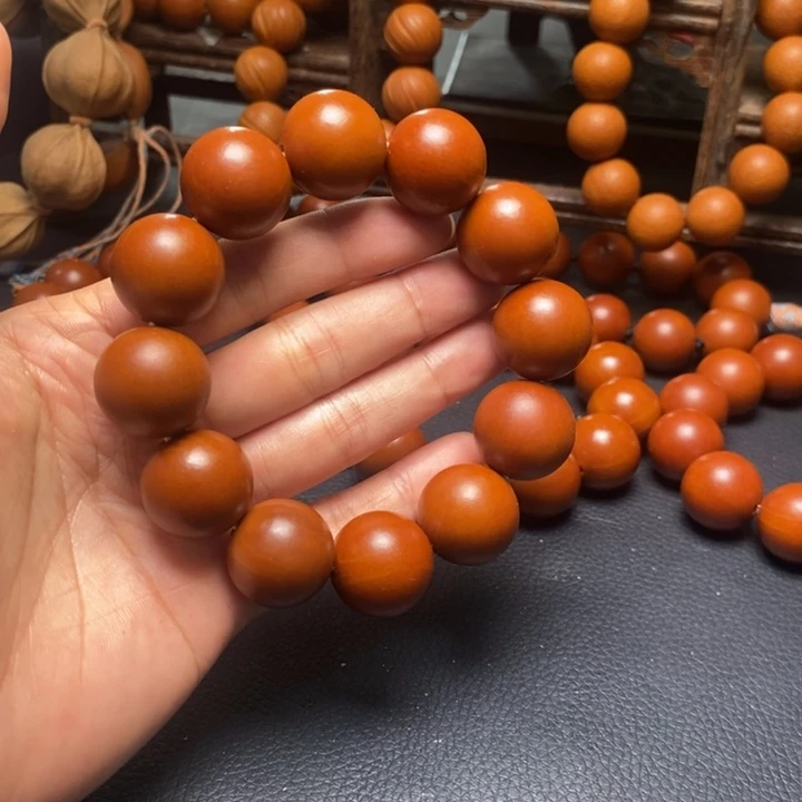 橄榄核手串1.95尺寸树王鸡血红光珠全品