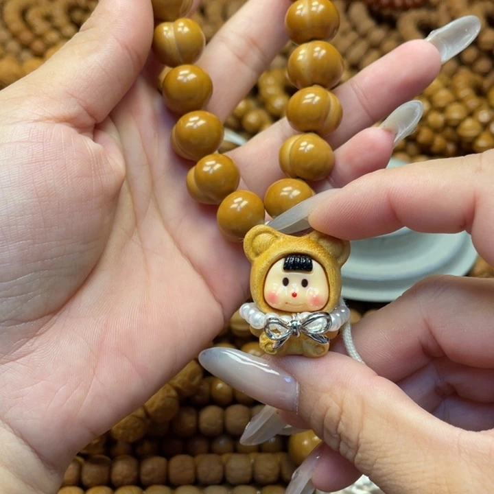 意***卿核桃微瑕亮面屁桃手持