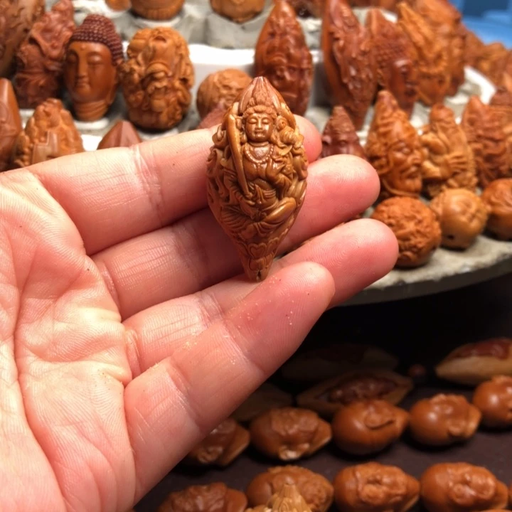 黎***明橄榄核吊坠橄榄核雕刻的单子