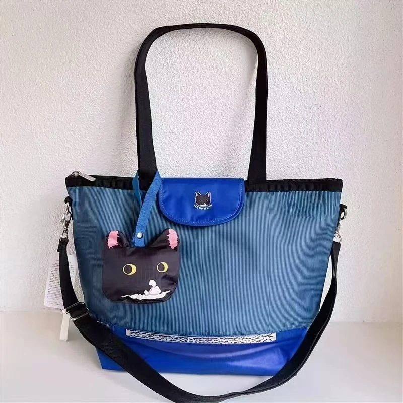 K144猫咪联名牛牛条纹手提包