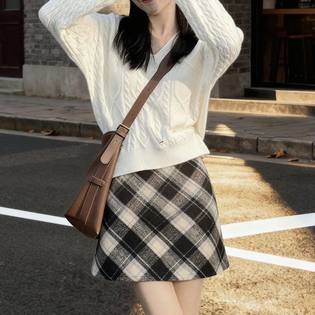 气质V领破洞设计慵懒风宽松针织毛衣+高腰A字显瘦毛呢半身裙套装