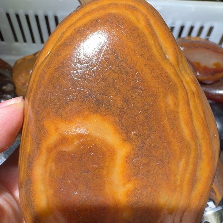 紫***风砖雕马达加斯加奇石手把件