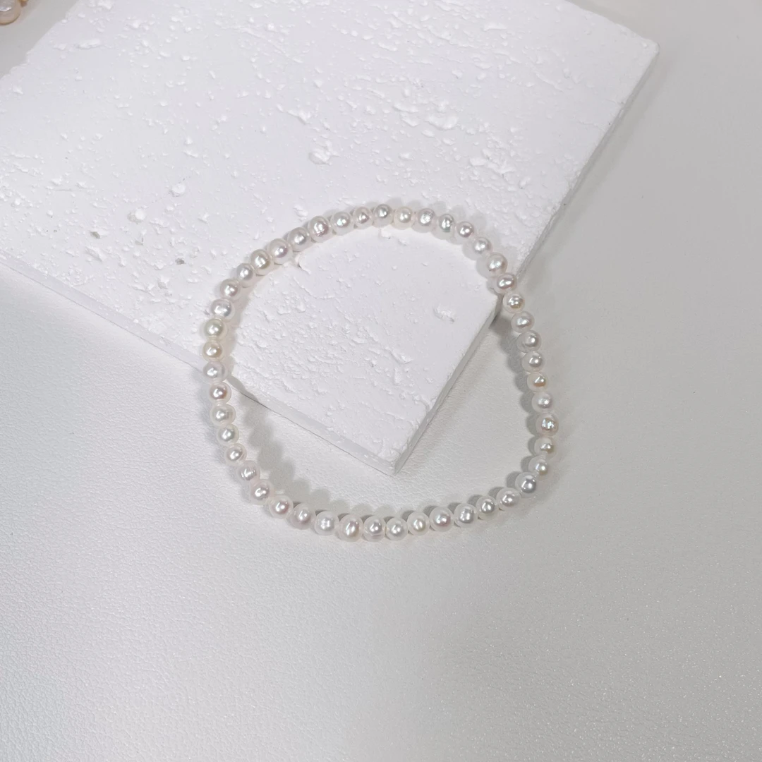 3-4mm天然淡水珍珠白色极强光小米珠弹力绳手串1039-1
