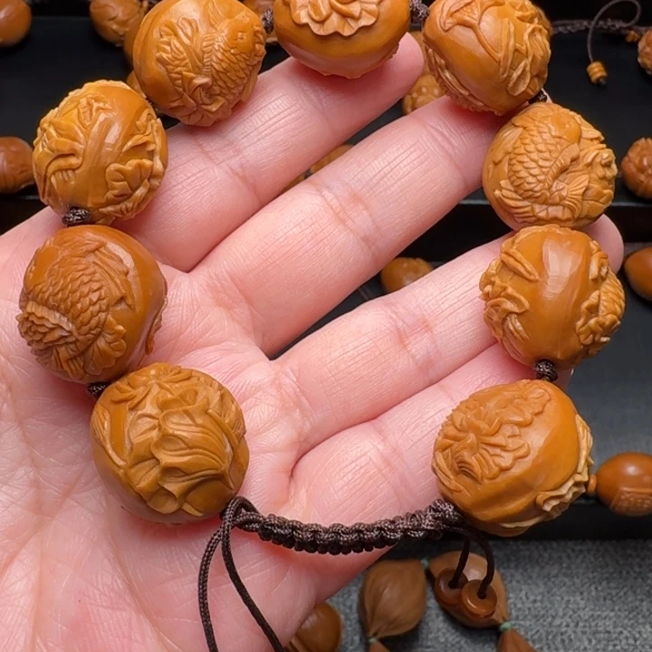 橄榄核手串/手链荷花鱼