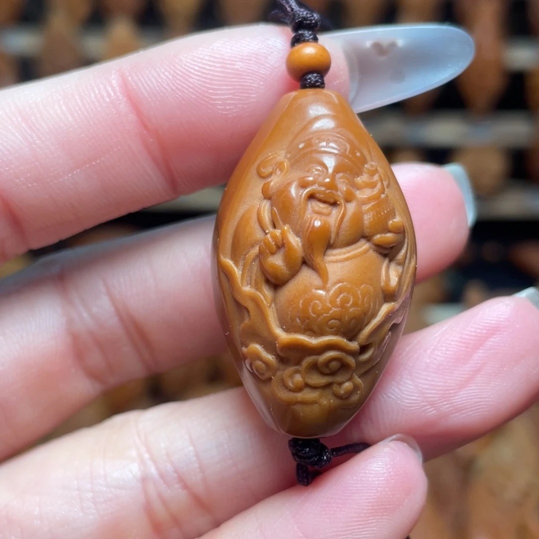 橄榄核把件包衣财神