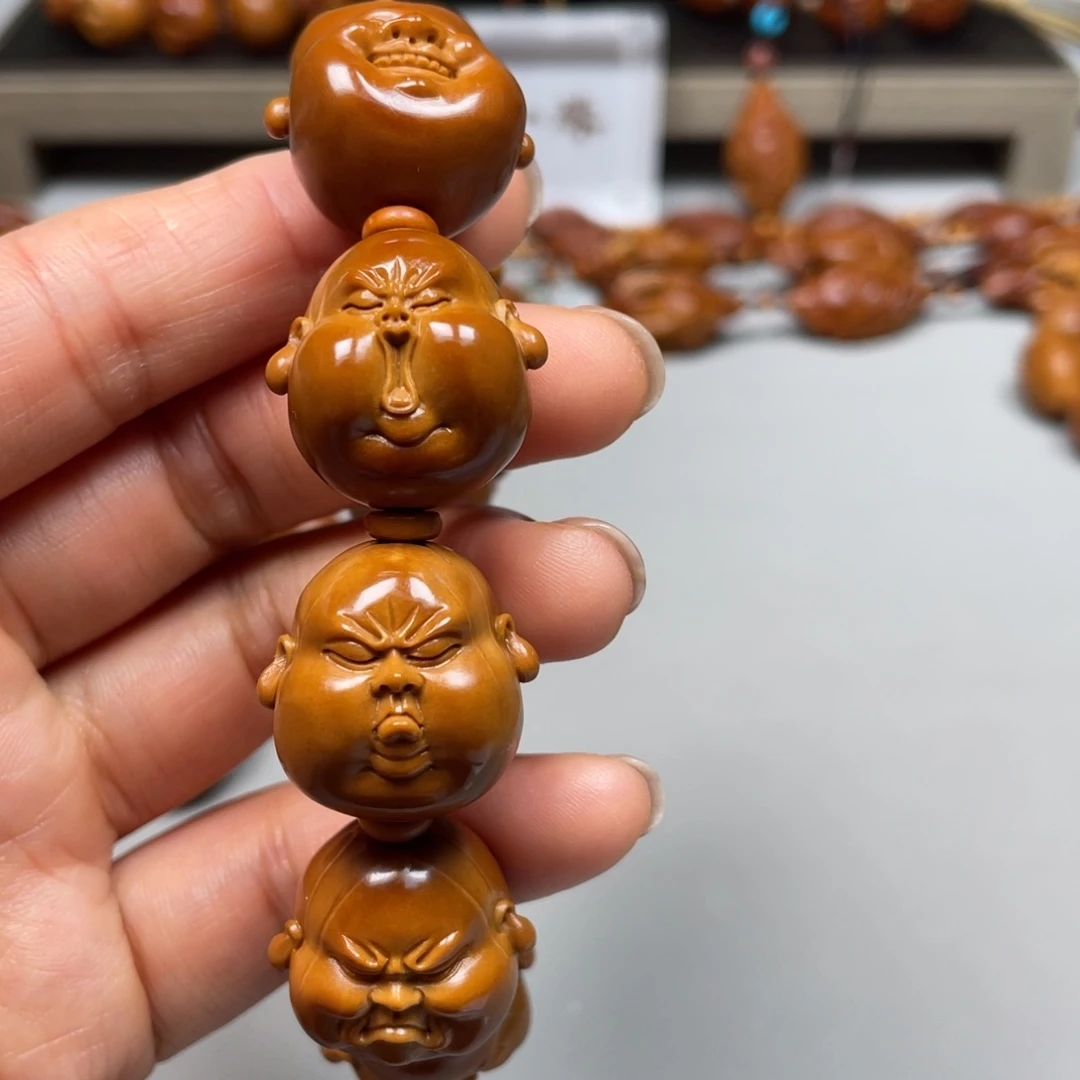 橄榄核吊坠否**来百态手串