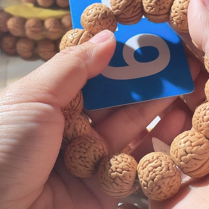 N***C吊坠桃核桃核手串苹果49