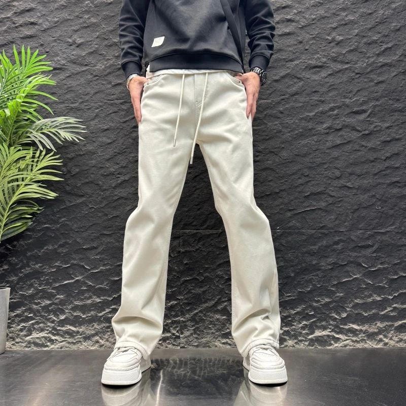 秋冬修身潮流长裤加绒加厚牛仔裤时尚新款宽松直筒百搭休闲微喇裤