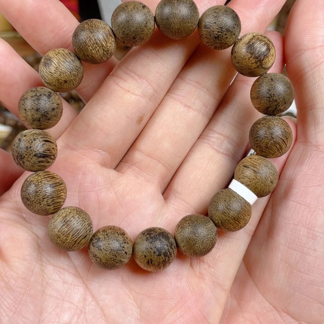 沉香手串【****珠菩萨棋树心老料1.3