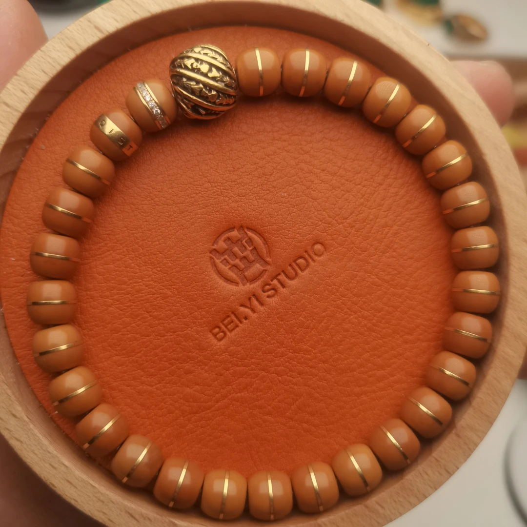 橄榄核文玩核金手串