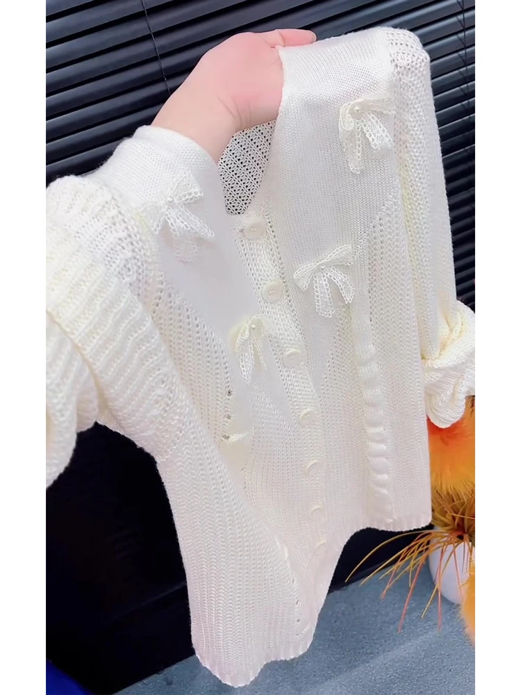 欧货镂空纽扣蝴蝶结针织衫上衣女秋季圆领小众宽松显瘦开衫外套潮