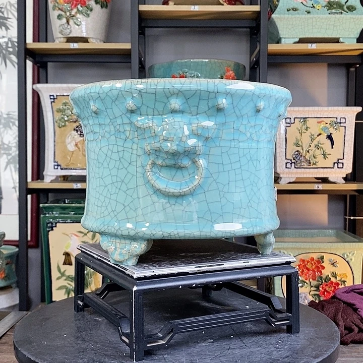 紫砂花盆苹**。5。