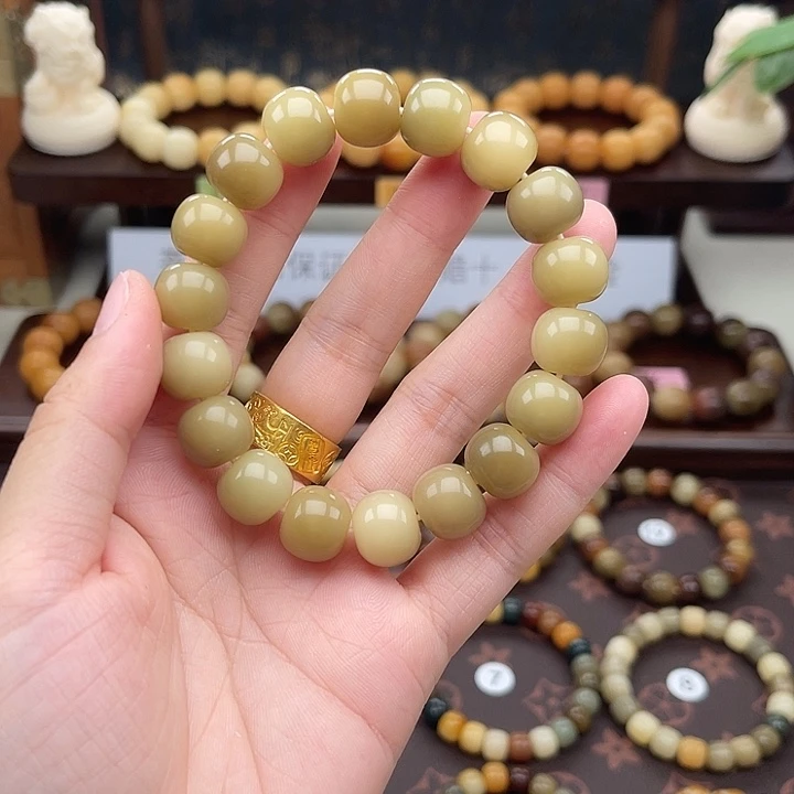 叶***）手串菩提根/象牙果玉化阴皮料