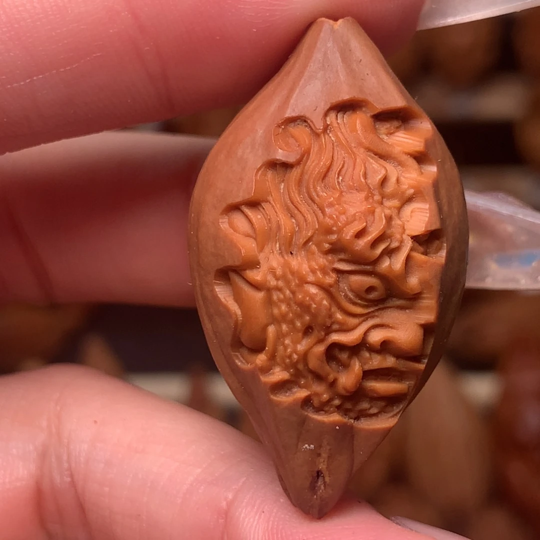 把件橄榄核包衣一念