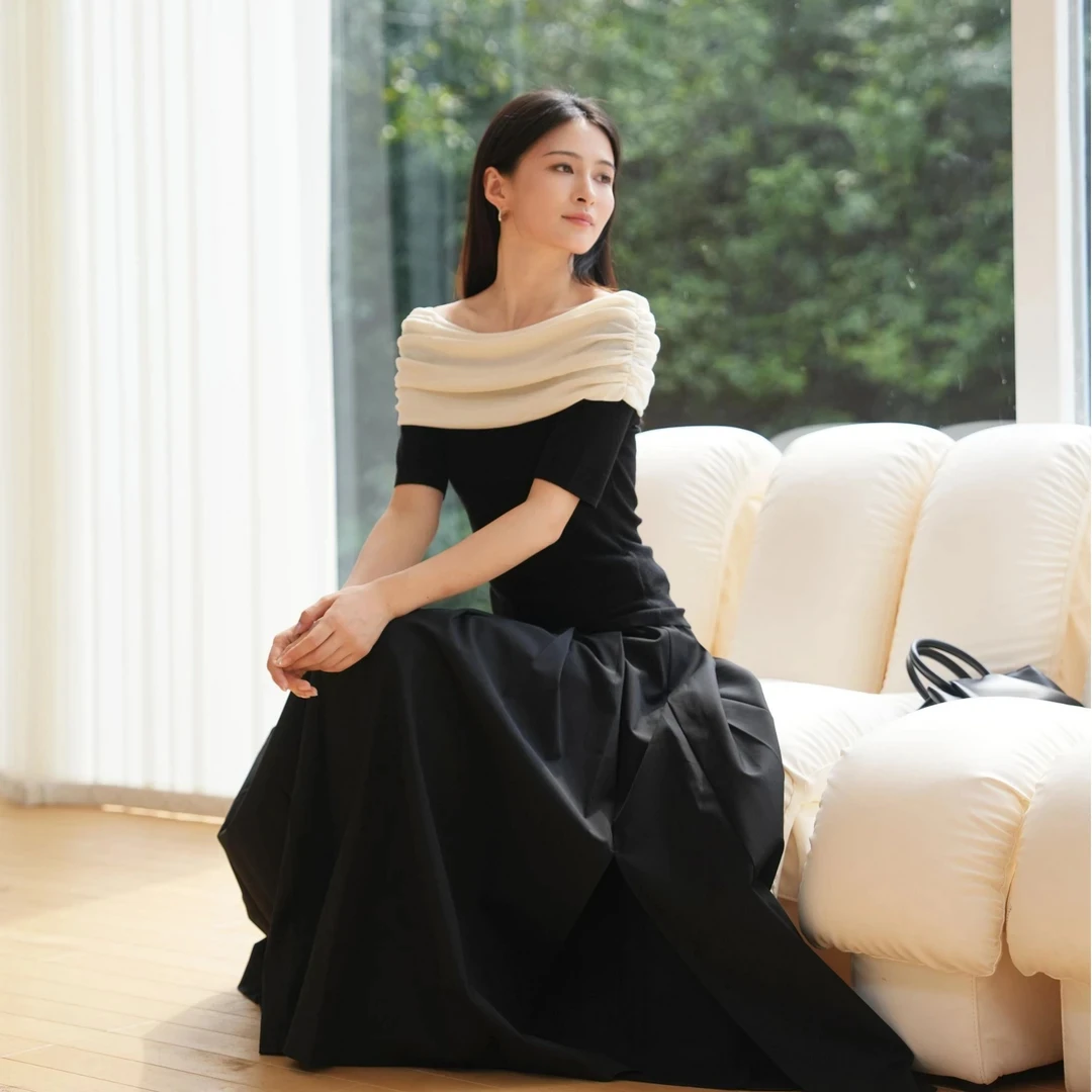 艾诺丝商场同款春秋季薄款套头款毛针织衫轻奢黑色一字肩中袖毛衫