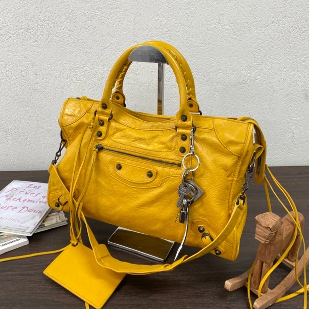 95新 Balenciaga/巴黎世家 芒果黄中号枪钉机车单肩斜挎包117647