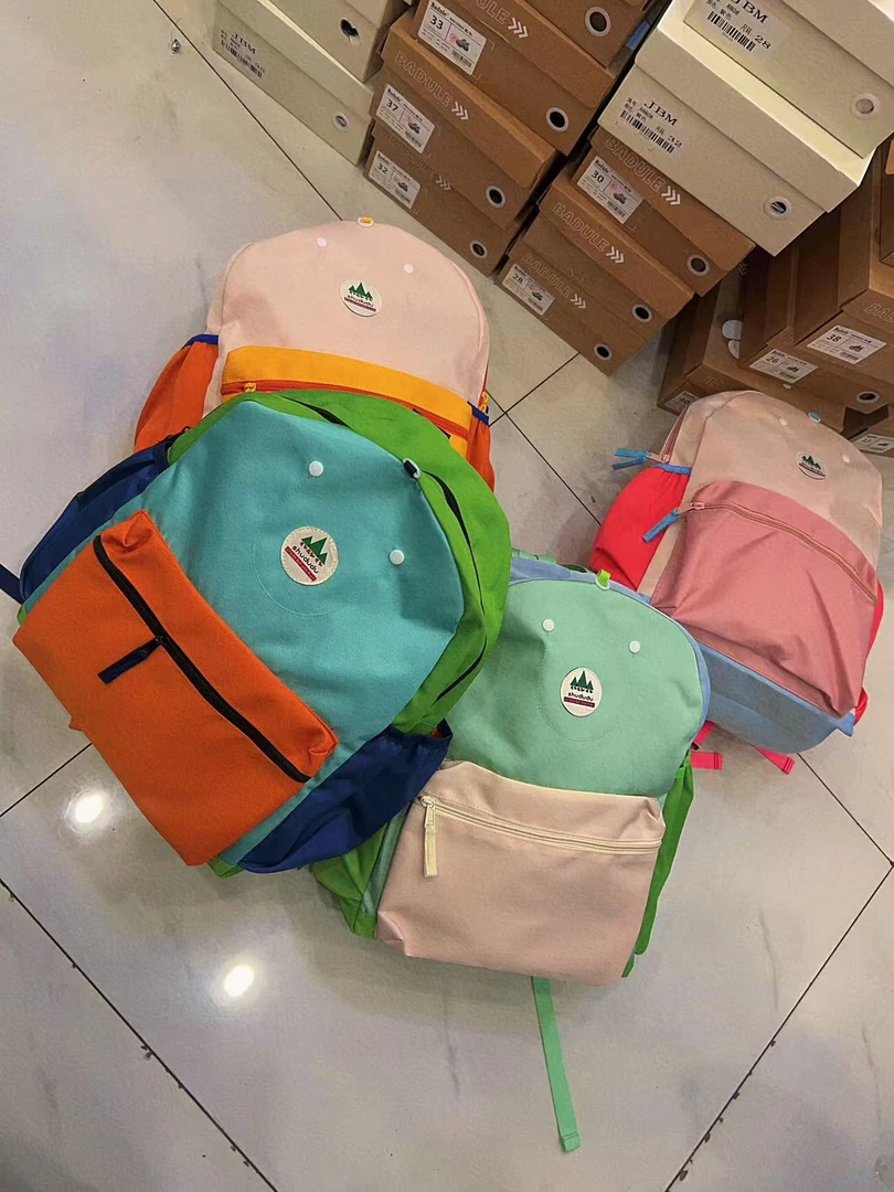 女中学生大容量简约轻便包包新款背包大学生旅行双肩包男2597