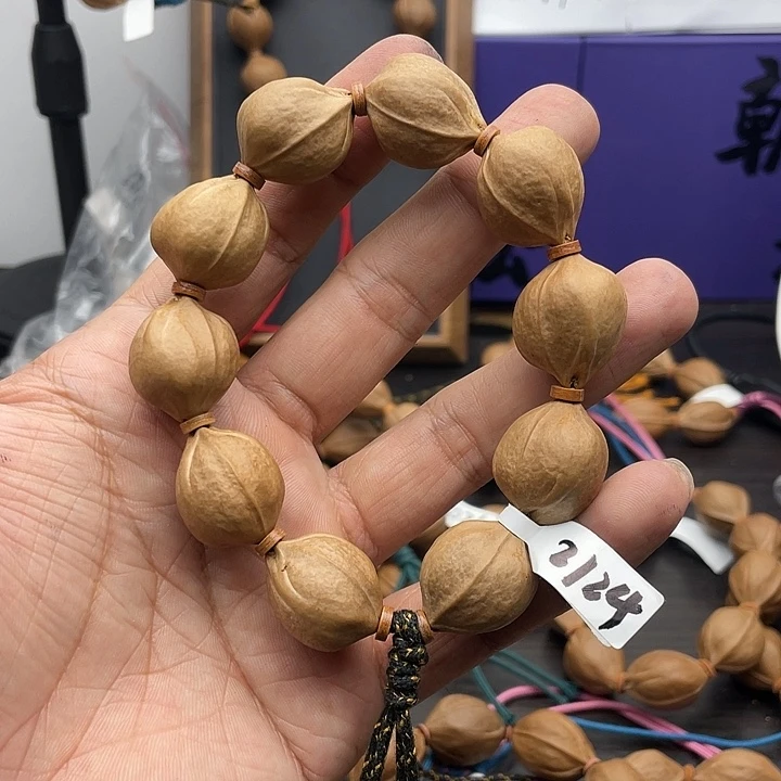孟***旺橄榄核吊坠2124梅林铁核……