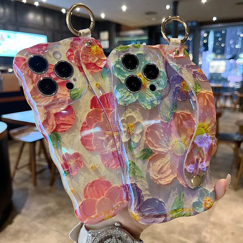 适用苹果系列iPhone16新款手机壳高级油画桃花精孔腕带支架扭扭边