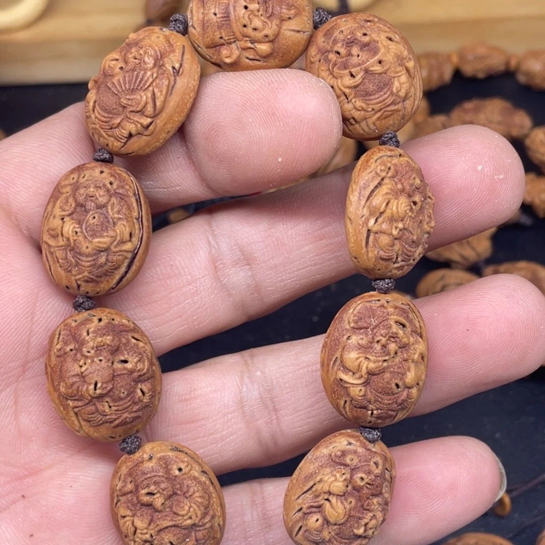 桃核雕刻财神手串