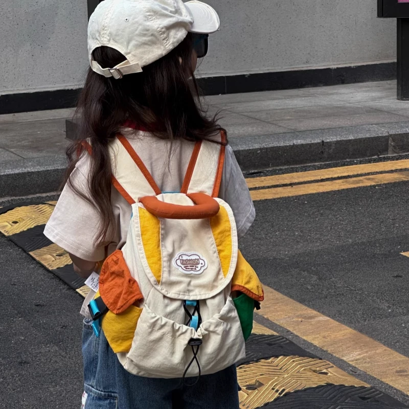 2025新款儿童书包幼儿园时尚撞色男女孩外出游轻便研学小学生背包