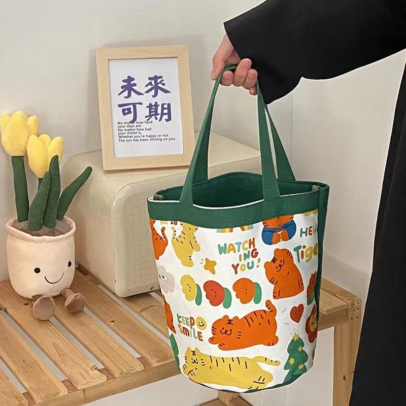 ins可爱卡通小老虎印花圆筒包韩国少女心水桶便当袋手提帆布包