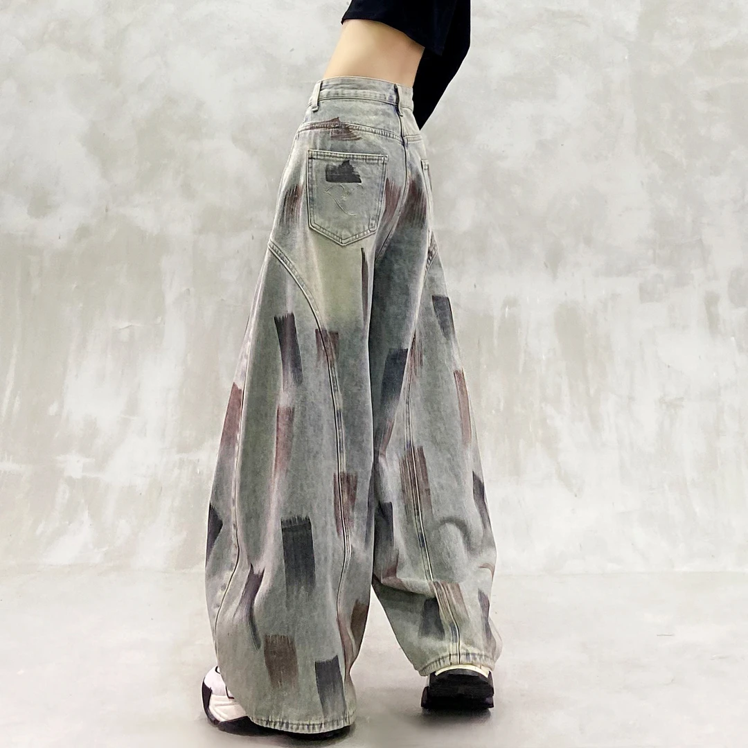 个性刷漆工艺水洗拼接休闲牛仔裤女秋新款高腰宽松显瘦百搭弯刀裤