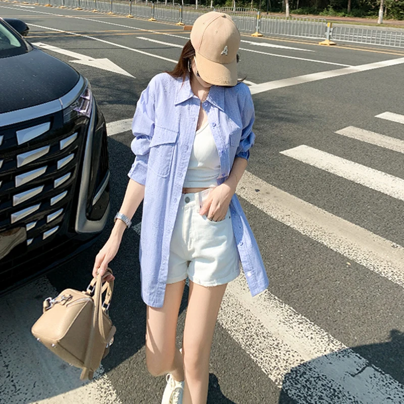 潮牌纯色单排扣春季新款女装炸街设计感小众宽松简约翻领长袖衬衣