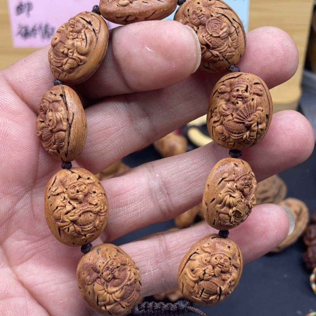 桃核雕刻财神手串