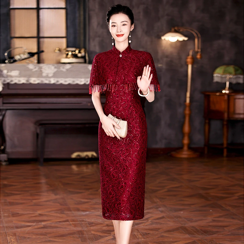 欧朵姬高端十一喜婆婆婚礼妈妈礼服2025新款秋季酒红色流苏连衣裙