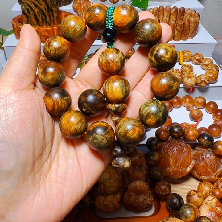 乌***鲨木质非金属琥珀木玉化手串