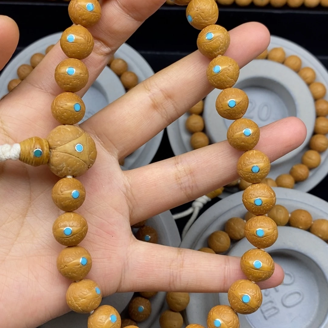 手串凤眼菩提12+新籽松手持