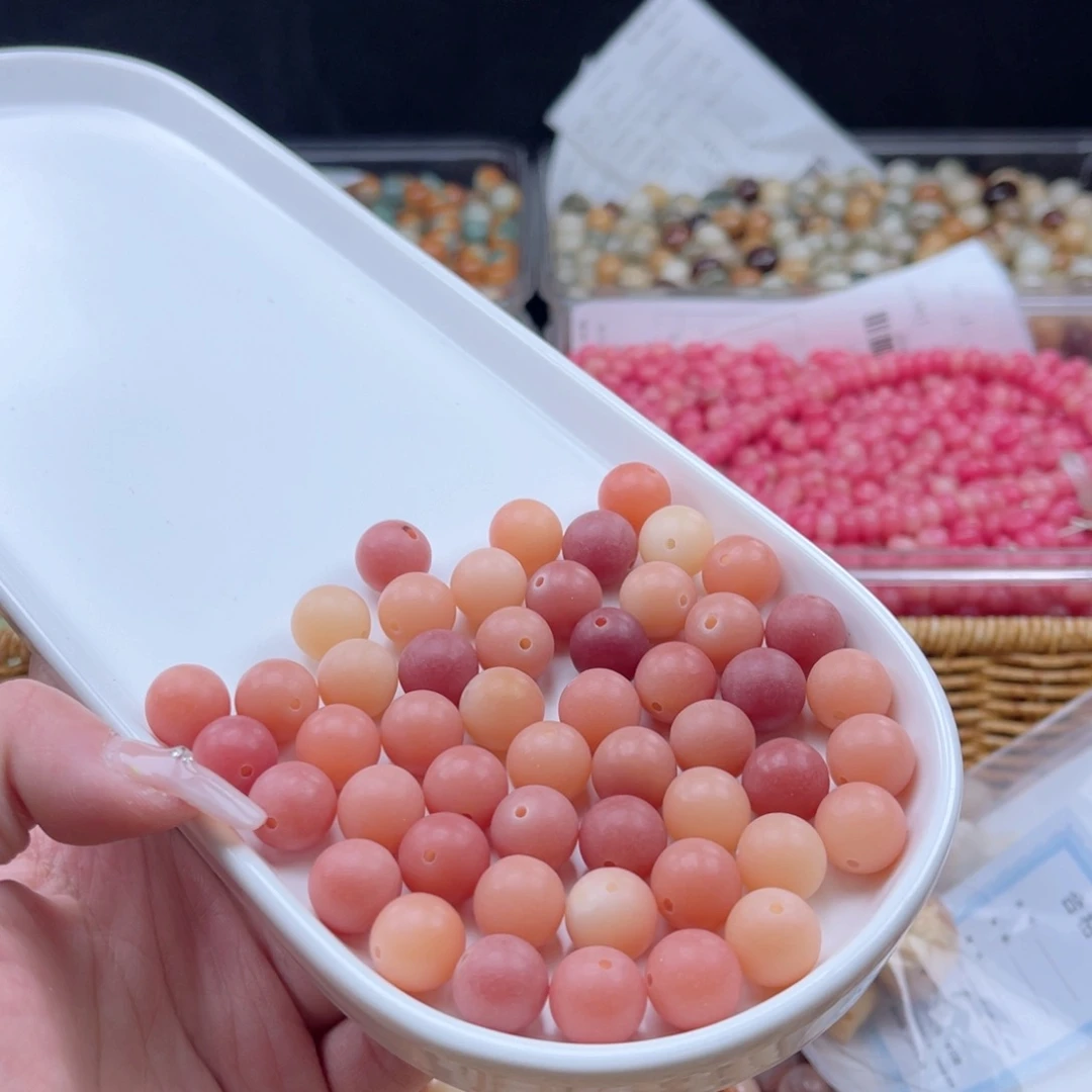 白玉菩提吊坠q12mm110颗。粉玉原果