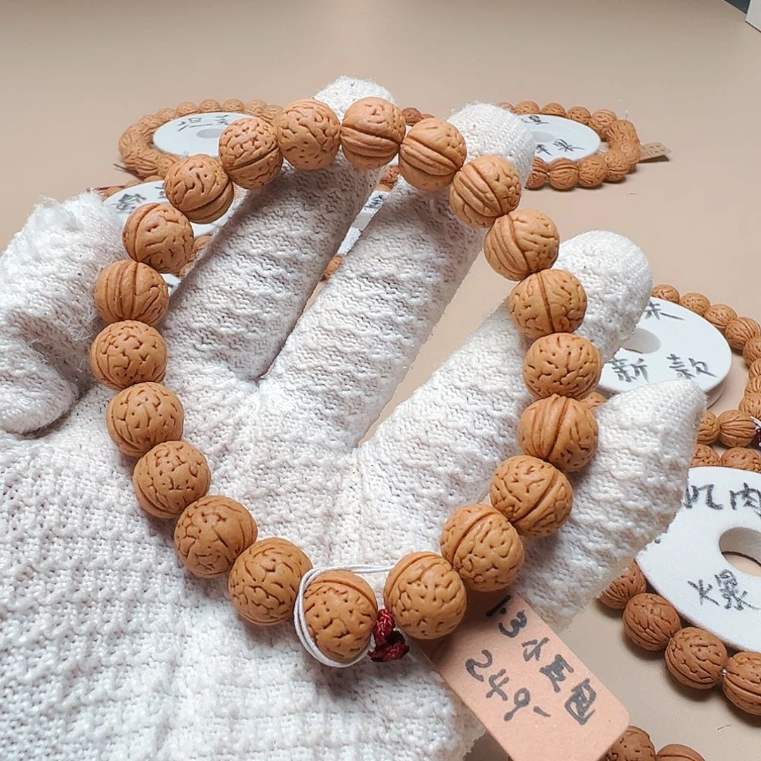 凡***客手串桃核1.3小豆包