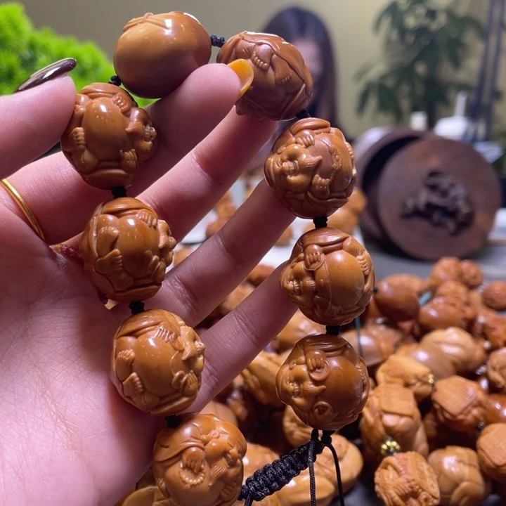 欠***儿吊坠橄榄核橄榄核雕