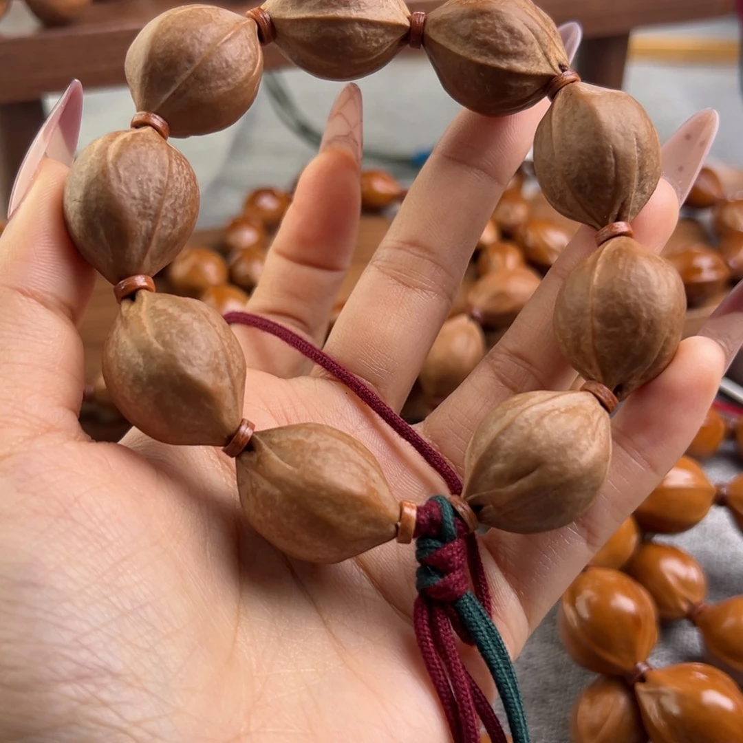 风***^手串橄榄核21/27三花梅林铁核