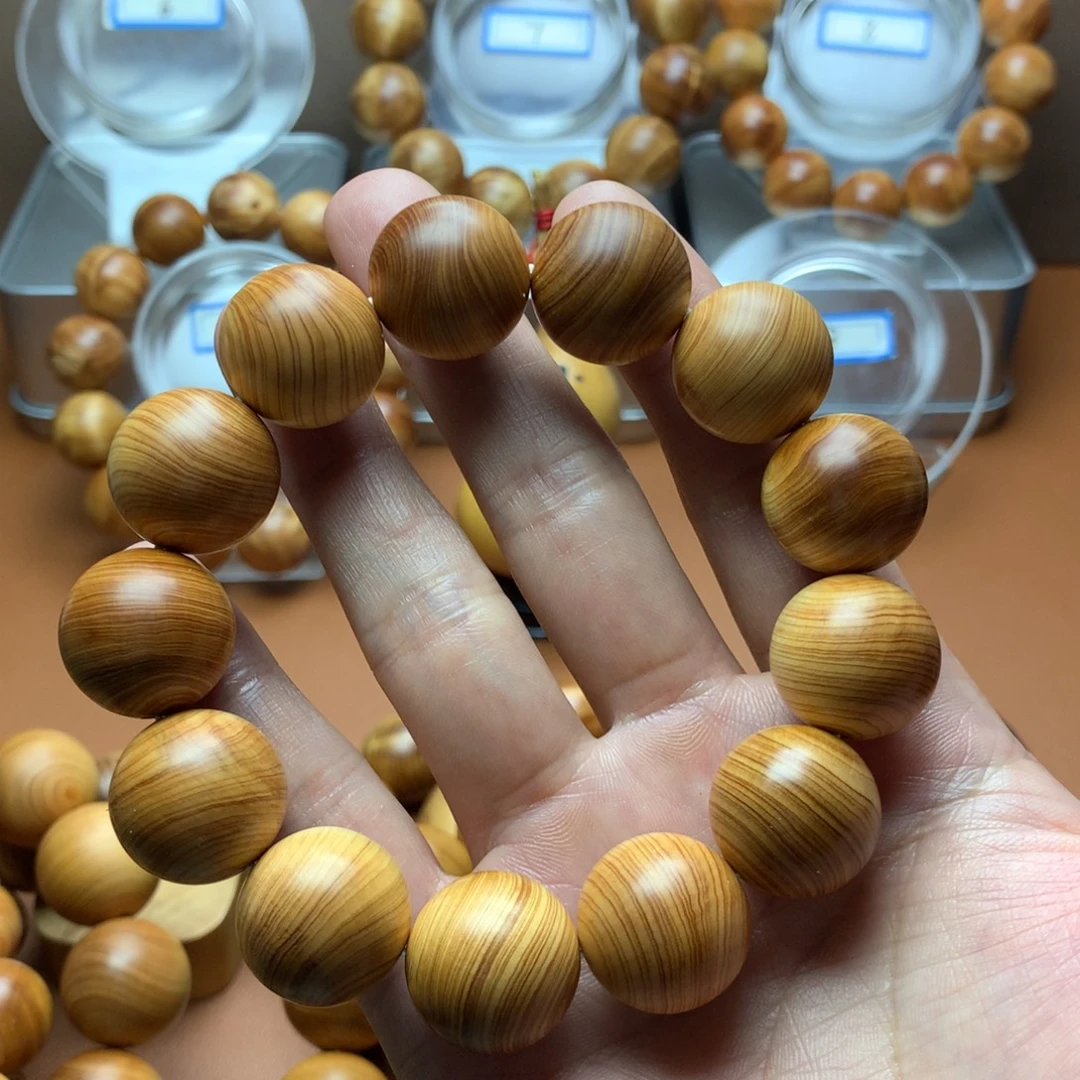 刘***捌手串/手链柏木18蚕丝纹黄金底