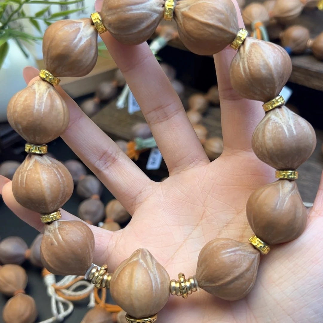 手串橄榄核001 23×26精品四花