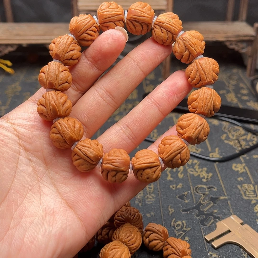 桃核吊坠包子头手串
